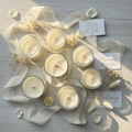 Customizable bulk candles in elegant glass vessels styled for weddings and baby showers